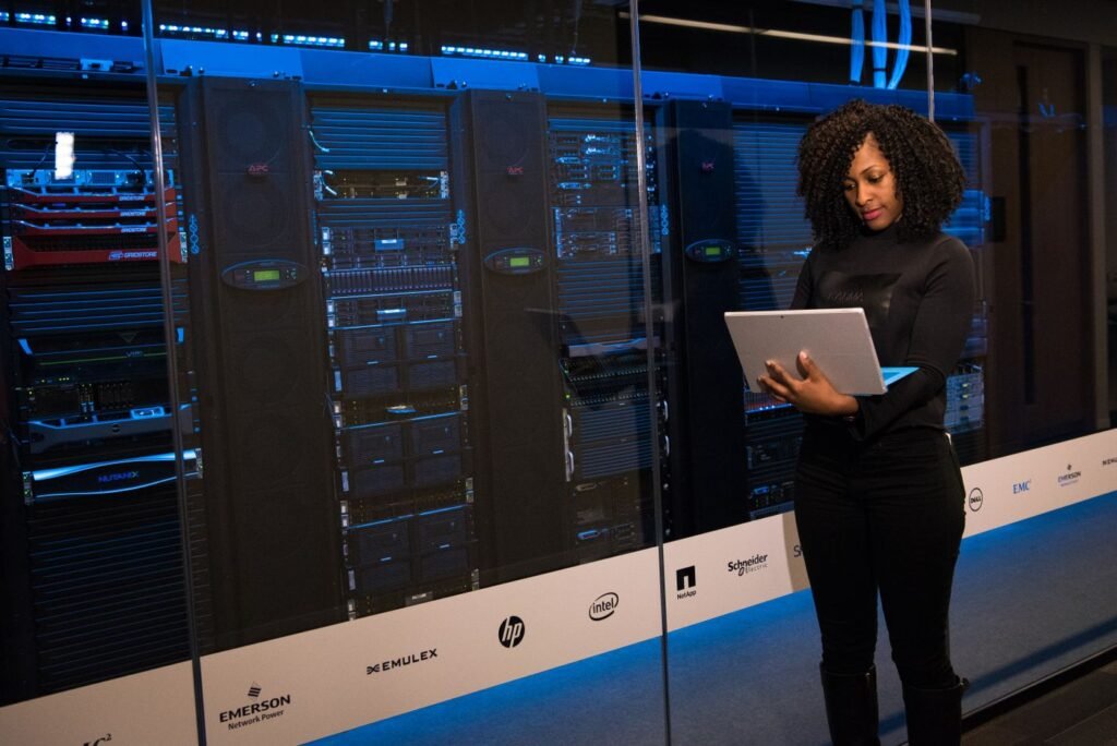 An IT administrator reviewing server infrastructure on a laptop, checking which tools still connect to Exchange Online